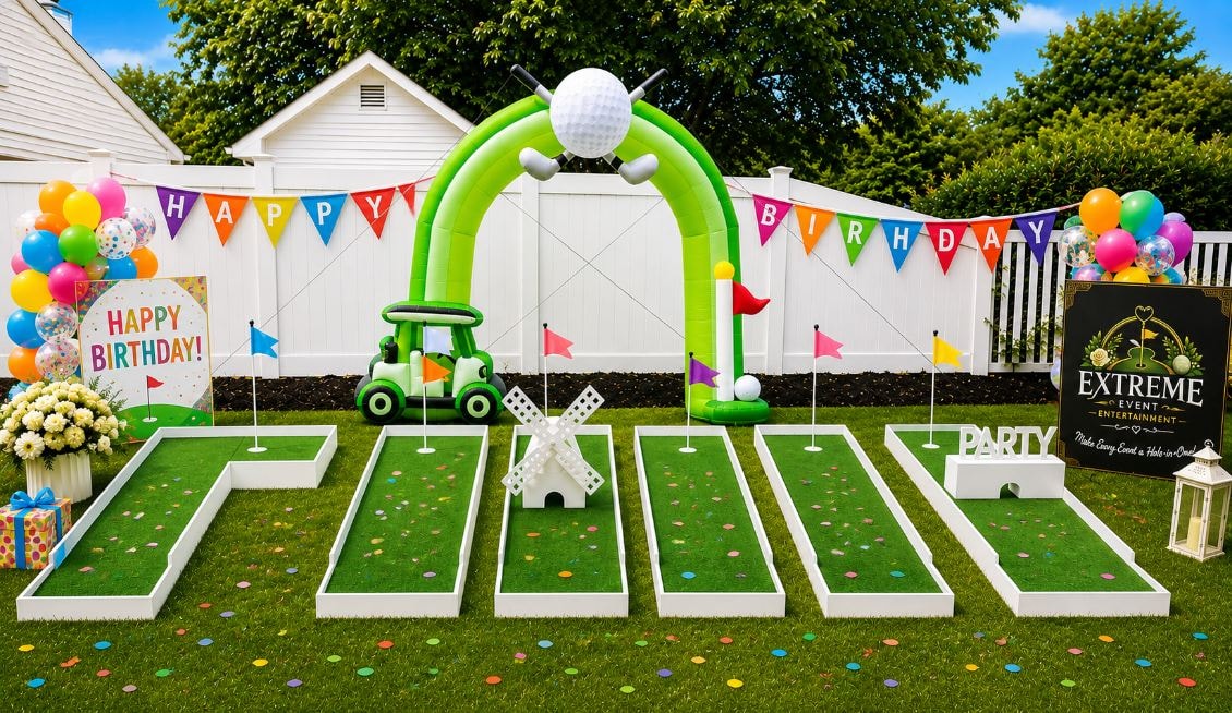 Extreme Event Entertainment birthday party mini golf setup with colorful balloons, inflatable arch, and custom obstacles